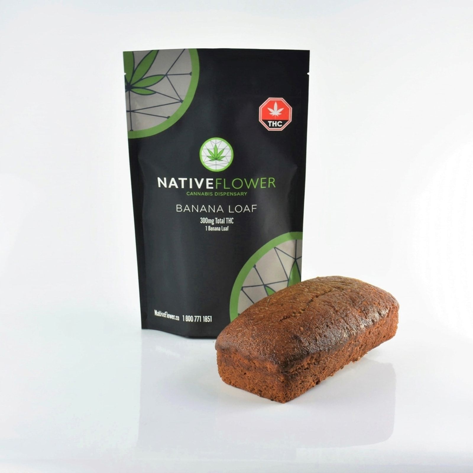 A Native Flower banana loaf standing in front of its black pouch on a white background.