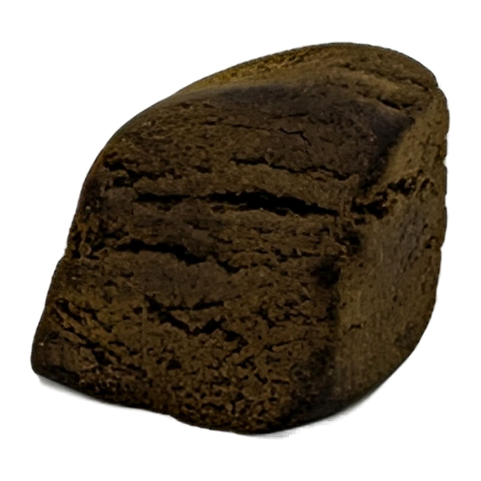 A single block of blonde Lebanese hash standing on end, the pressed layers visible down the cut face.