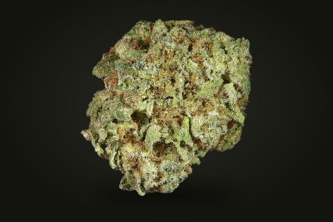 A cured bud of Grapefruit, light green with copper-orange hairs under a glassy frost, on a plain black background.