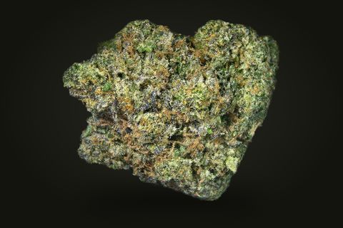 A cured bud of Holy Grail, compact and dark green with orange hairs under a glassy frost, on a plain black background.