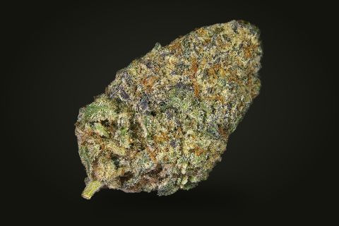 Kosher Kush from another side: a tapered bud with orange hairs and a short stem at its base, on a plain black background.