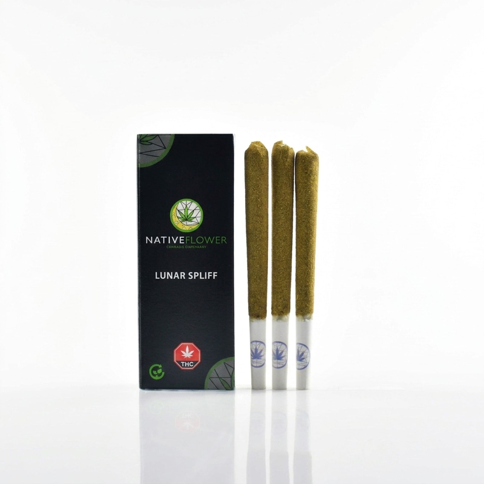A black Native Flower lunar spliff box standing beside three upright kief-coated spliffs, on a white background.