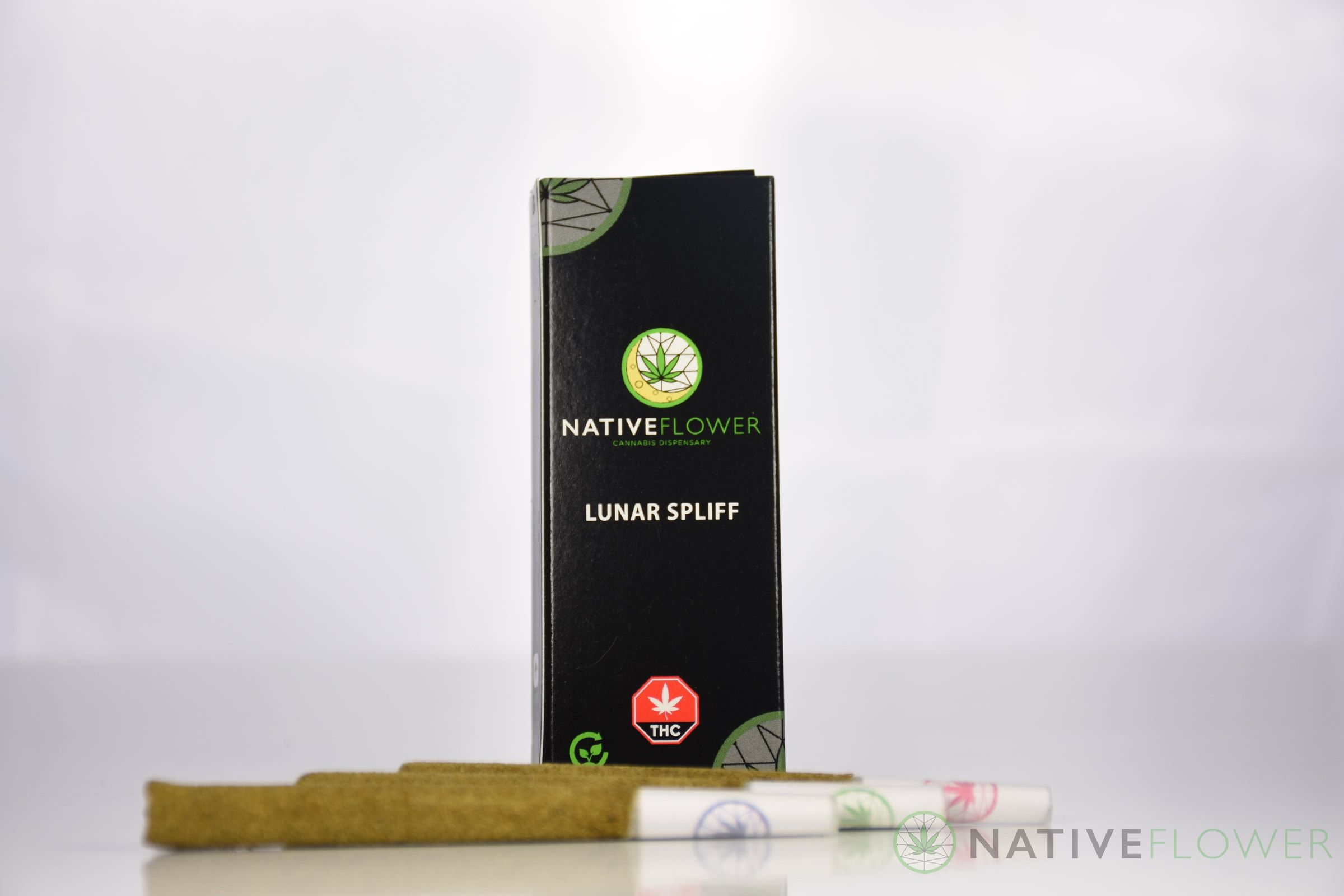 The carton standing behind three spliffs laid out in front of it.