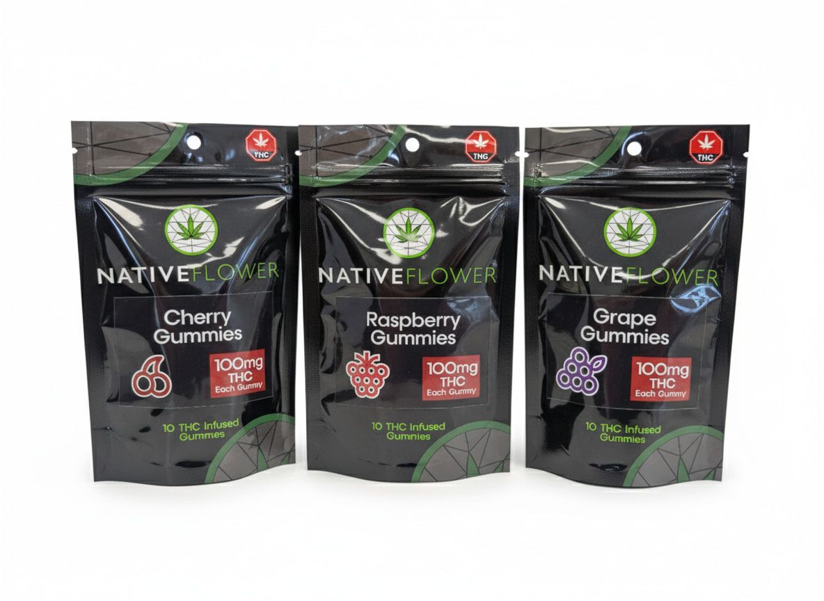 Three black Native Flower gummy pouches in a row — cherry, raspberry and grape.