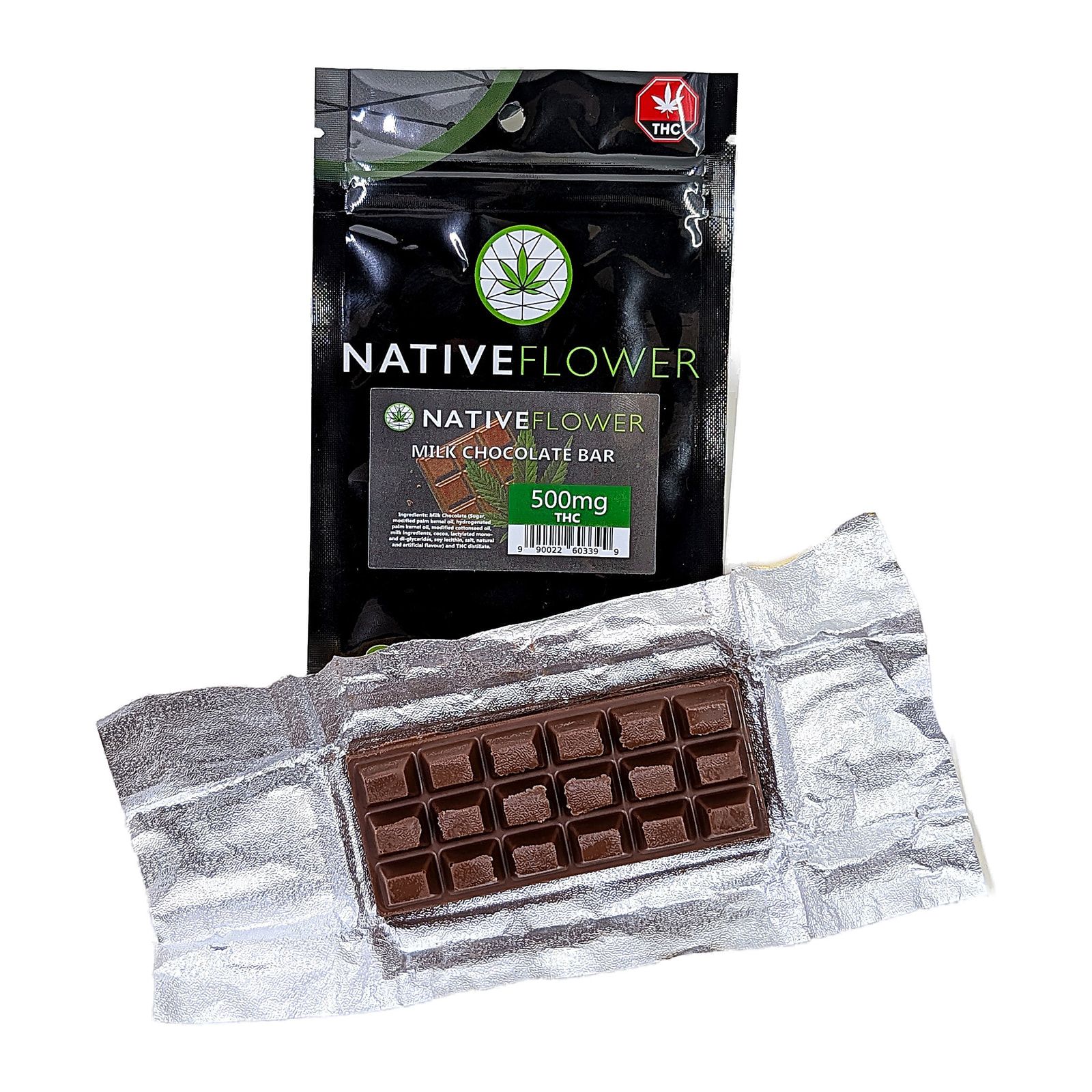 A milk chocolate mini bar unwrapped on its silver foil in front of its black Native Flower pouch.