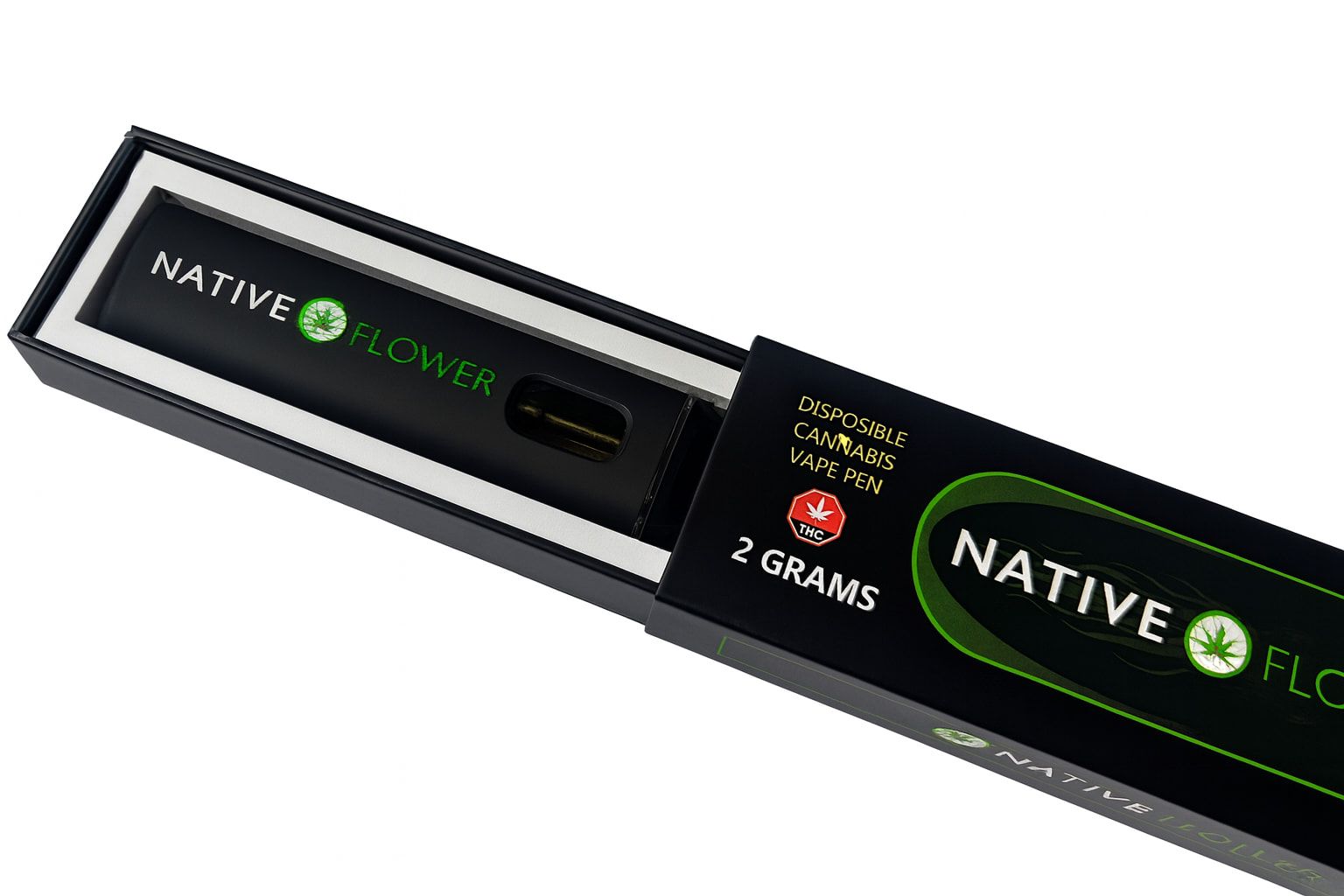 A disposable vape pen lying in its open presentation box, sleeve alongside.