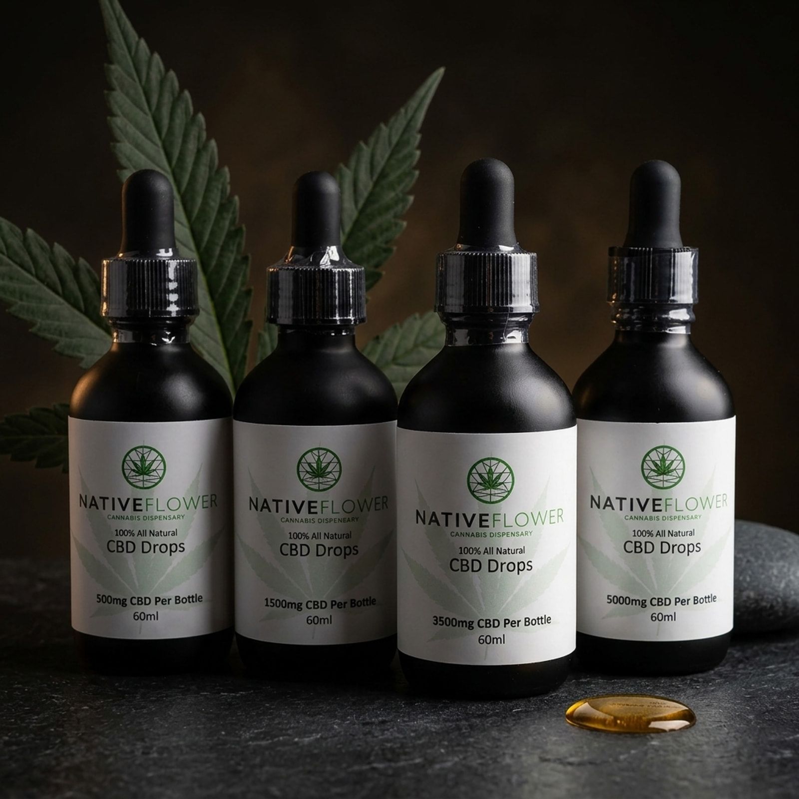Four Native Flower CBD drops bottles with black droppers in a row, a cannabis leaf behind and a drop of oil in front.