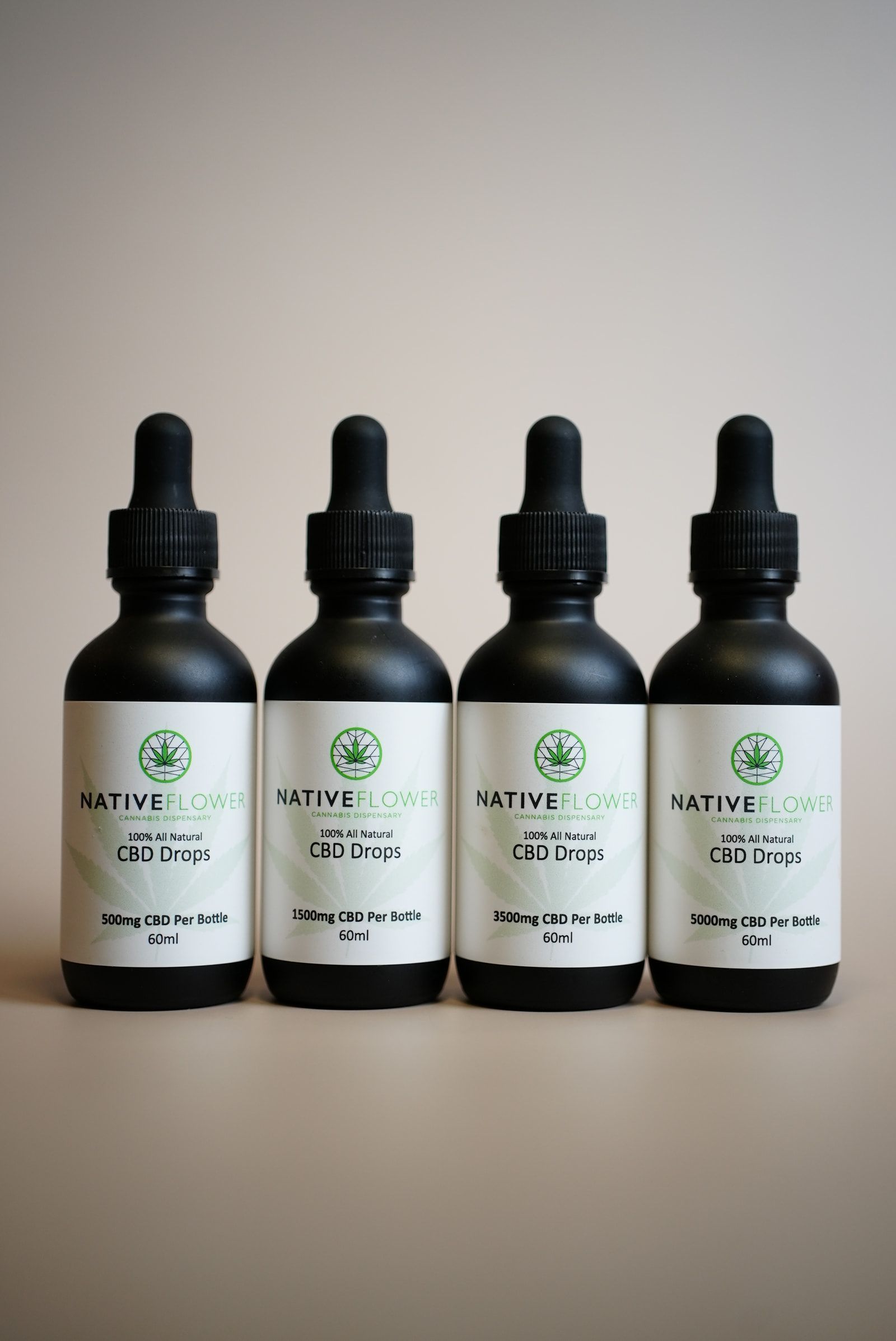 All four strengths of Native Flower CBD drops standing in a row.