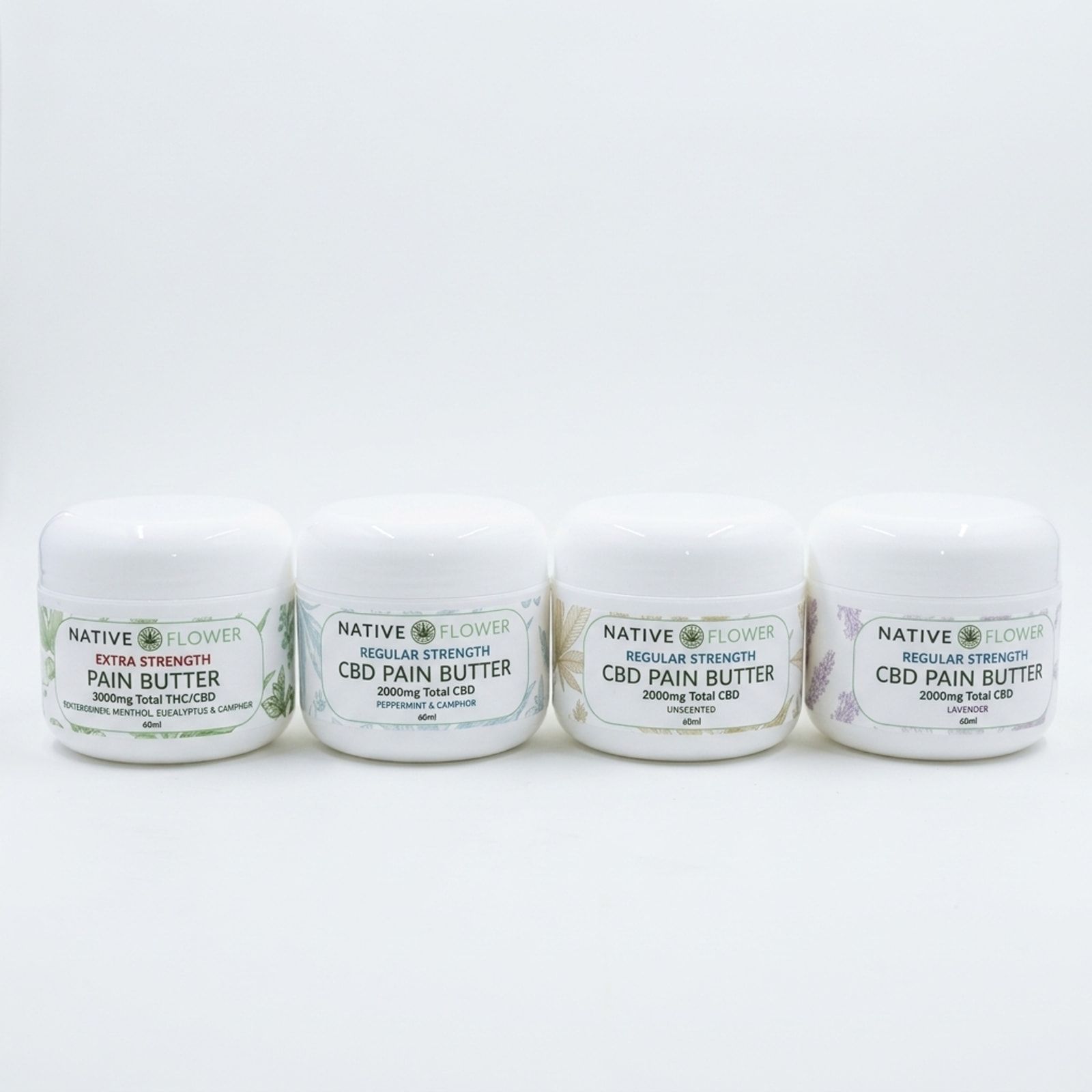 Four white tubs of Native Flower topical butter in a row, one label lettered in red, on a white background.