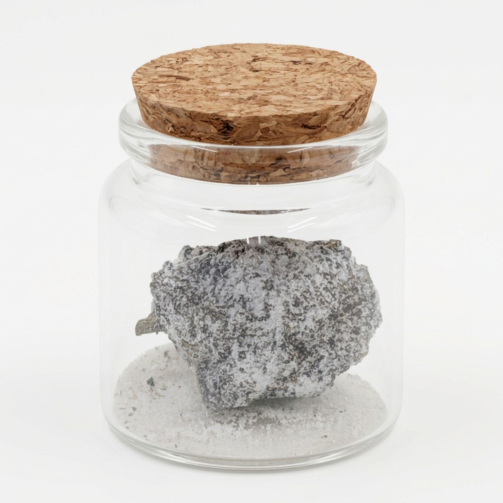 A white-coated cannabis bud on a bed of white powder inside a cork-stoppered glass jar, on a white background.